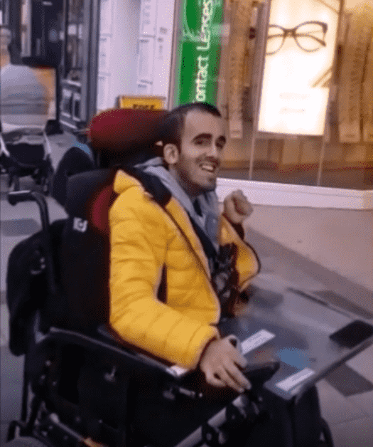 A person in a wheelchair

Description automatically generated