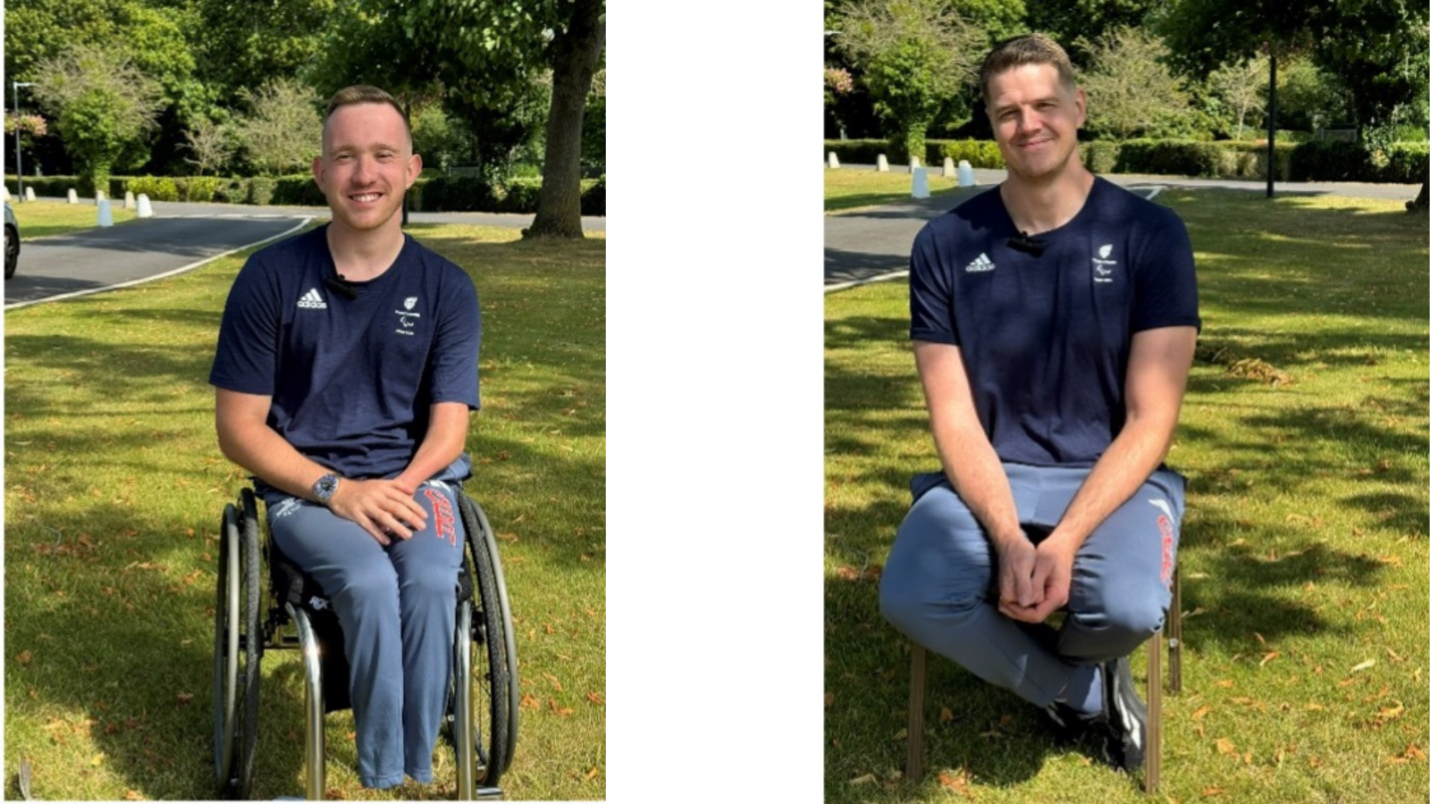 Paralympians Gregg Warburton Men's Wheelchair Basketball Classification 2.5 & Lee Manning Mens Wheelchair Basketball Classification 4.5. Gregg seated in his wheelchair and Lee sat on a chair outdoors on the grass. They are wearing dark blue ParalympicGB shirts with sponsor logos and light blue athletic pants. Both smiling, with their hands resting on laps. The background features a grassy area, trees, and a paved path under a bright and sunny sky.