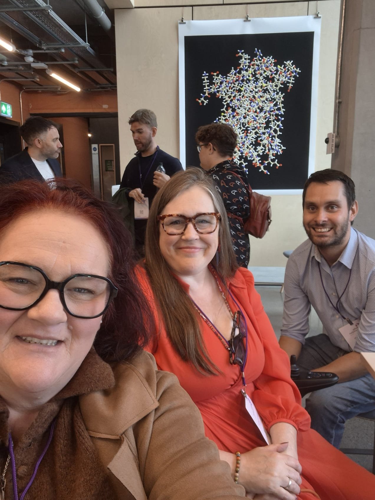 Academy graduates Kayleigh Northall, Yolanda Barker and Harry Smith smiling for a selfie during the Disability Journalism Forum Conference in Leeds.